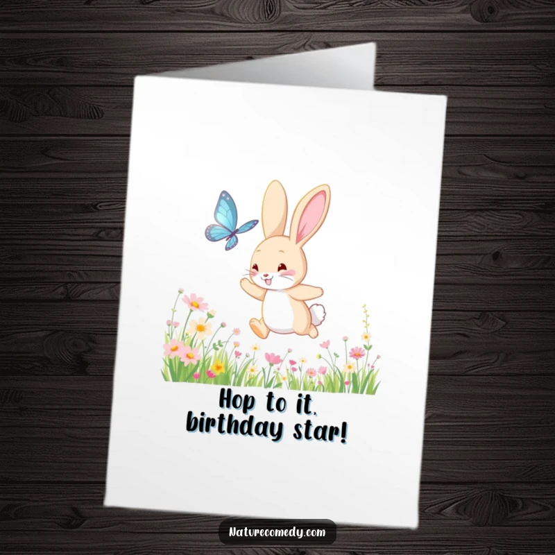 Funny Free Printable Birthday Card: a bouncing bunny joyfully chases a shimmering butterfly through a meadow full of wildflowers.